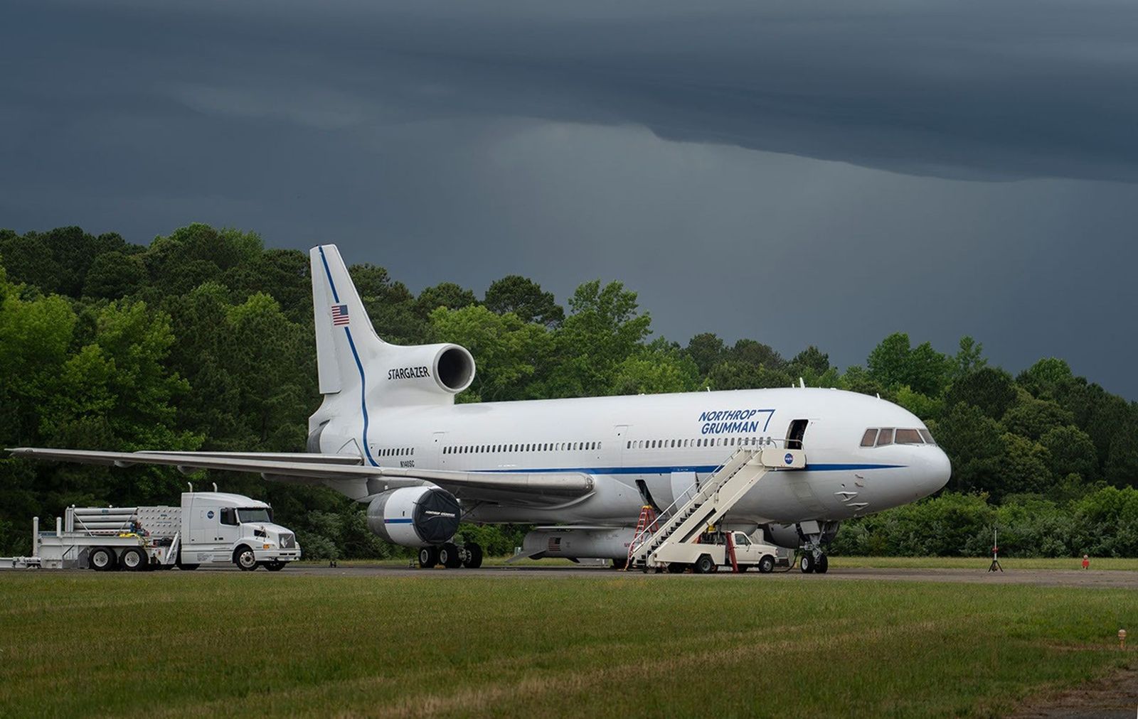 An airplane with a rocket attached to its belly
