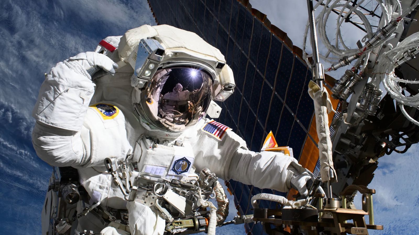 NASA astronaut and Expedition 72 Flight Engineer Anne McClain is pictured near one of the International Space Station’s main solar arrays during a spacewalk on May 1, 2025 to upgrade the orbital outpost’s power generation system and relocate a communications antenna.