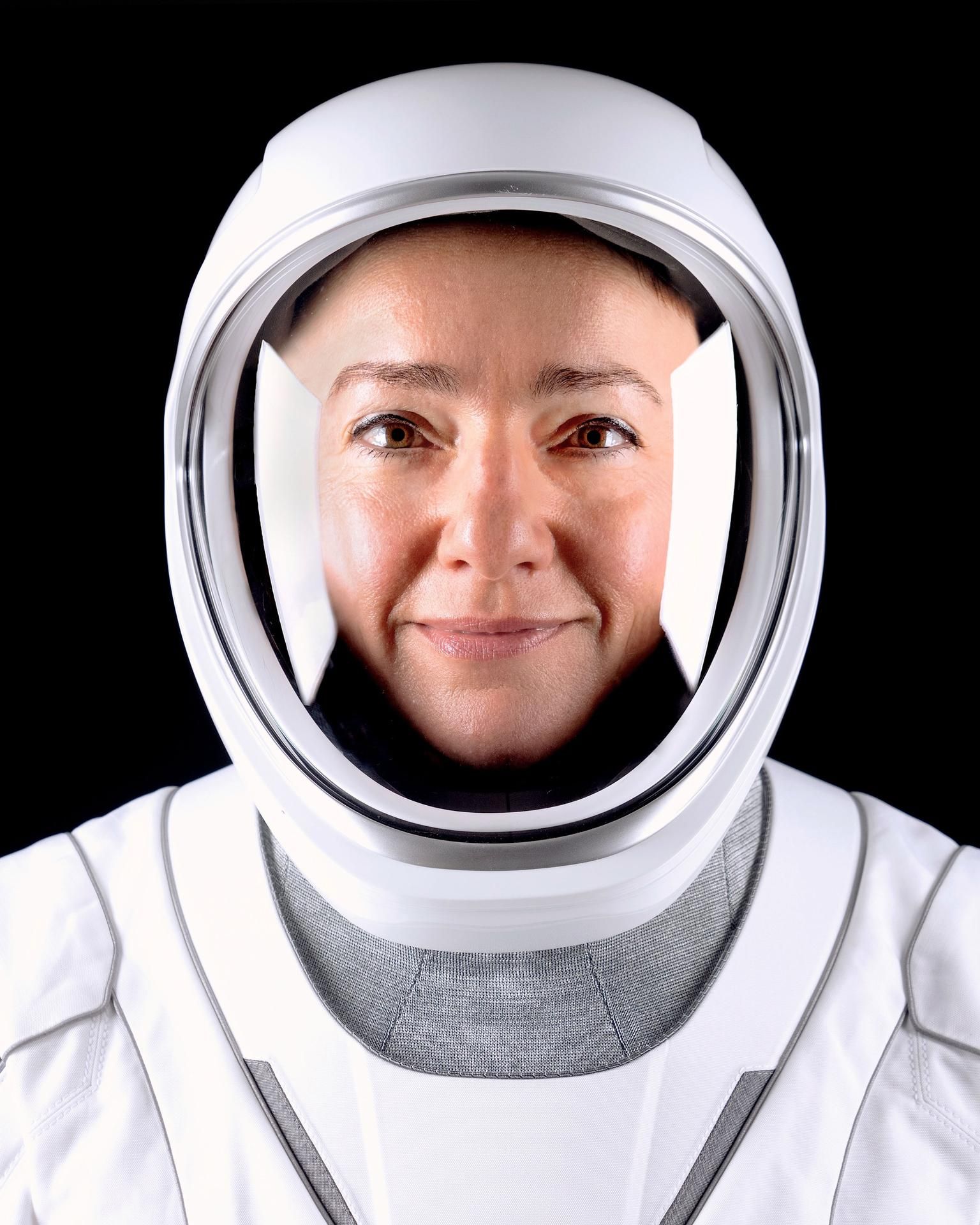 A person in a white spacesuit.