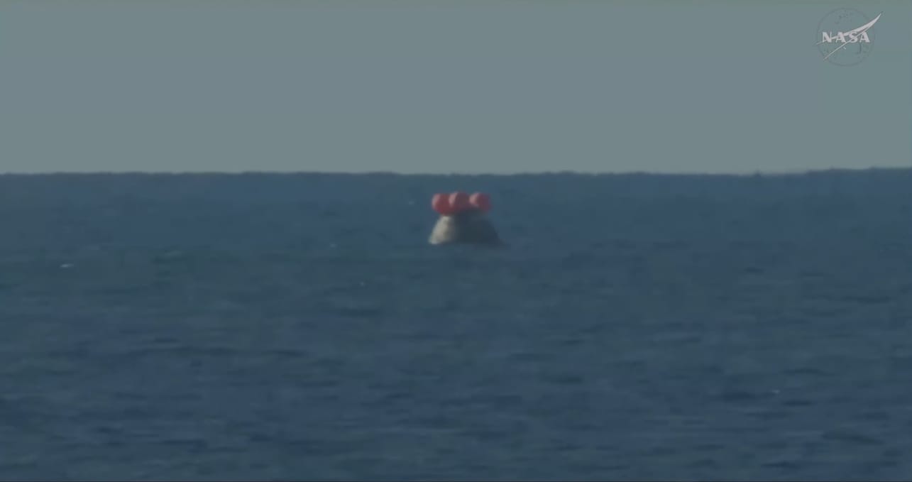 The Orion spacecraft with the Artemis II crew inside is seen floating in the Pacific Ocean after splashing down at 8:07 p.m. EDT on April 10, 2026.