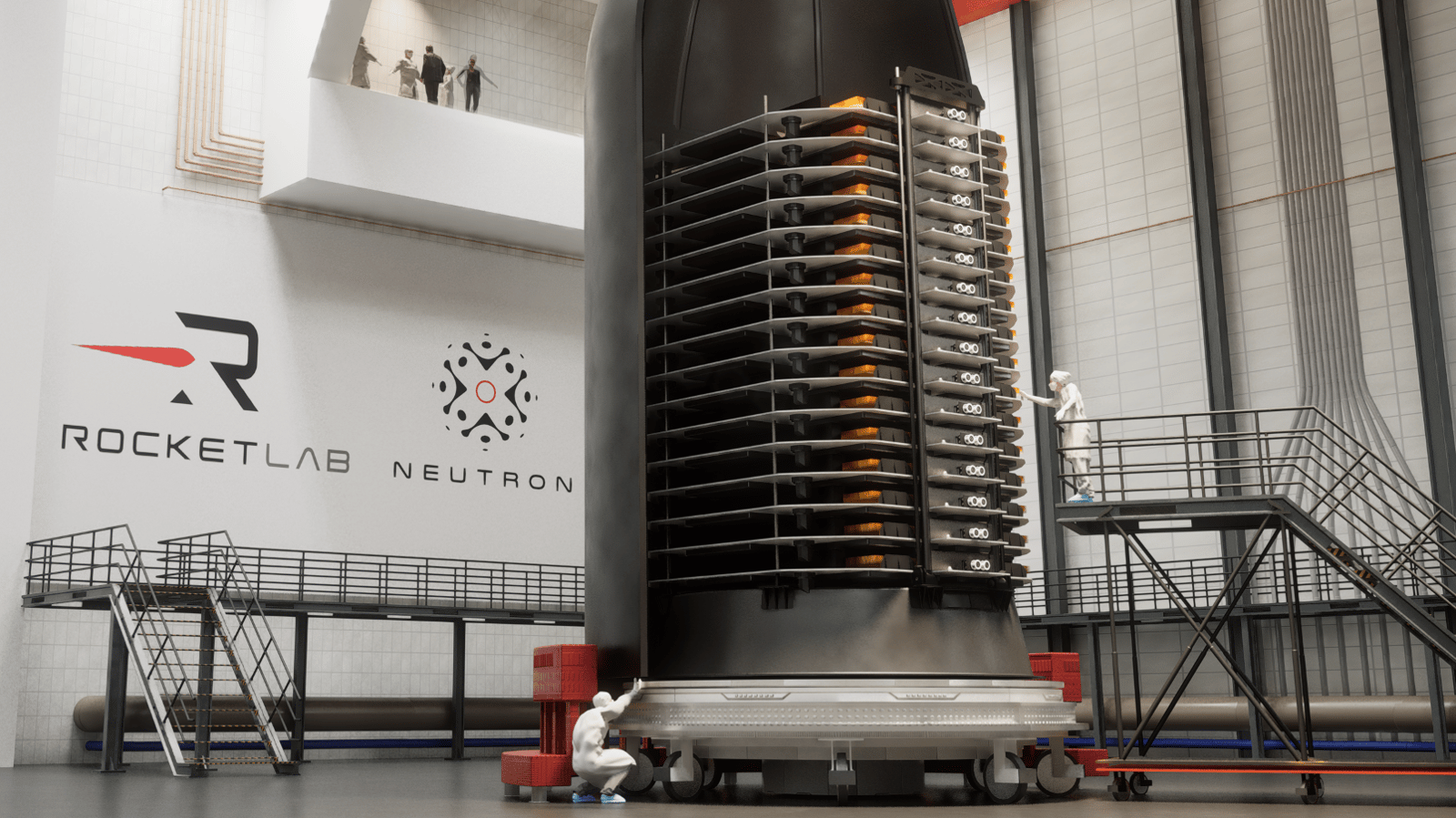 A stack of thin satellites sits in half a rocket fairing in a clean room.