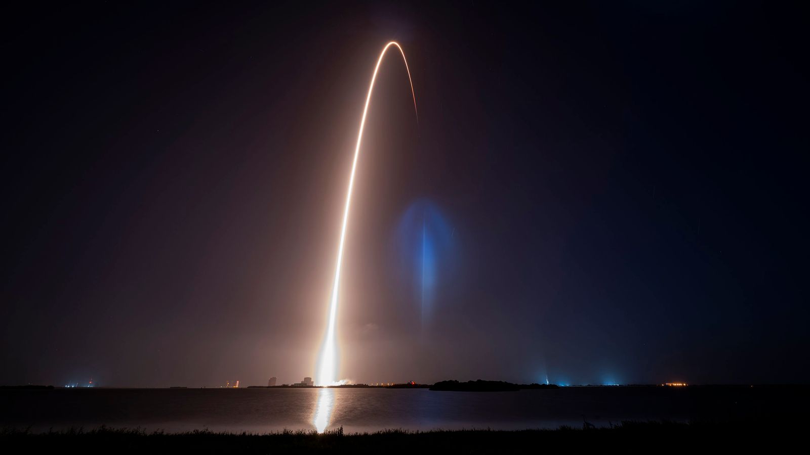 view of rocket launch streak and the rentry landing of the booster