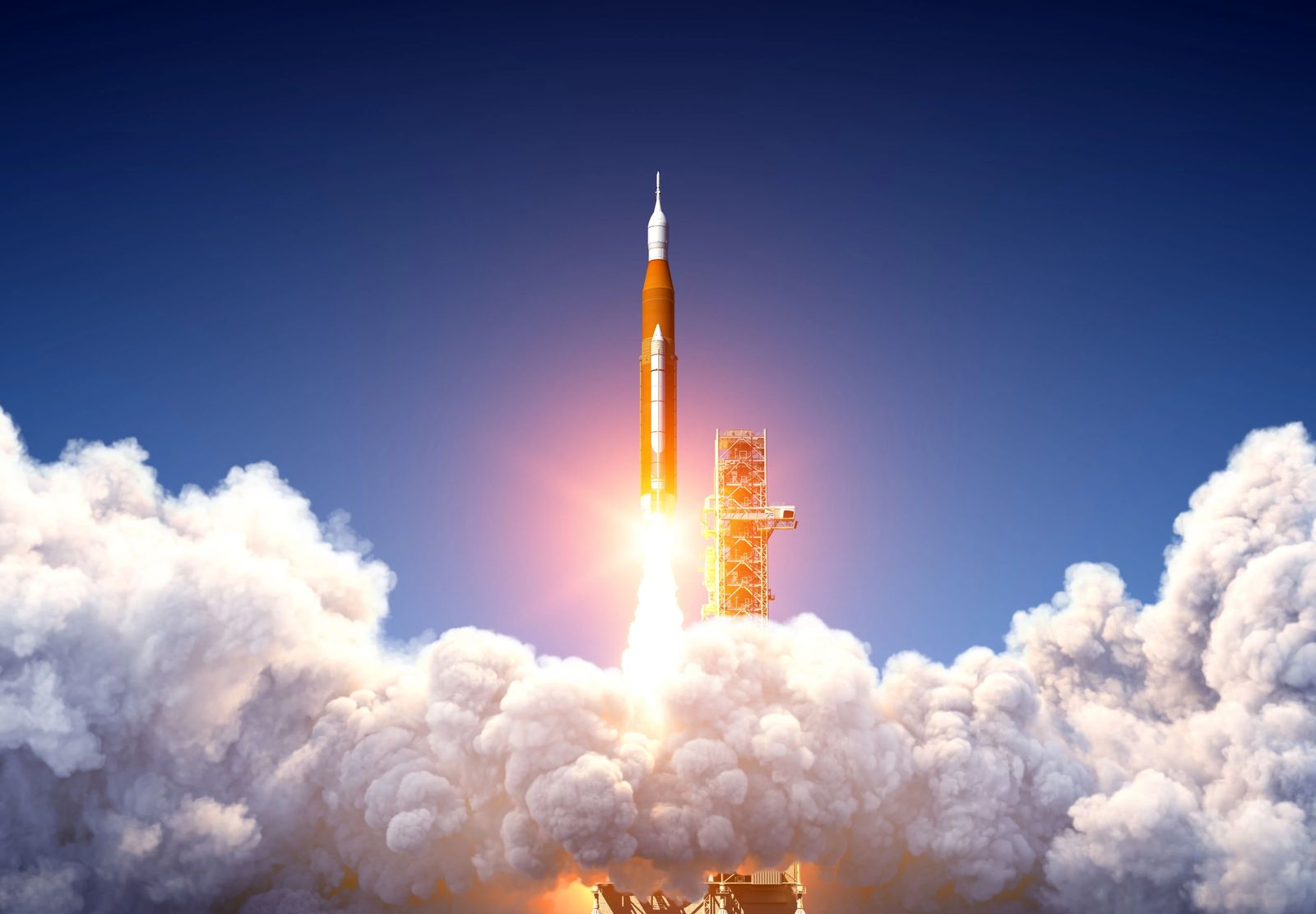 A rocket is lifting off of a launchpad.