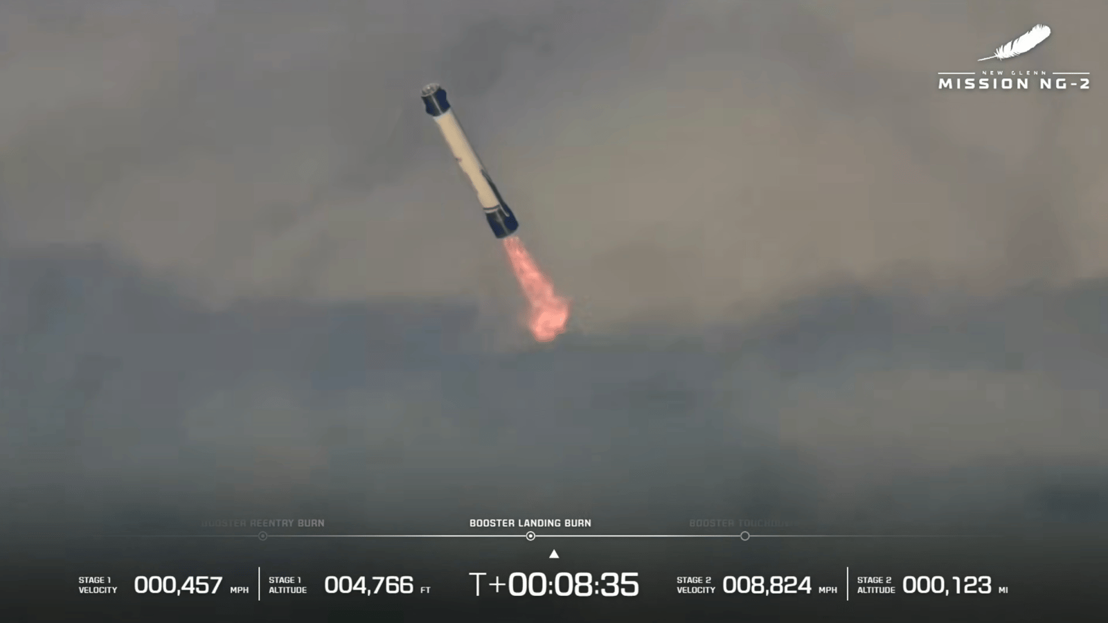 a large white-and-blue rocket fires its engines as it descends through clouds