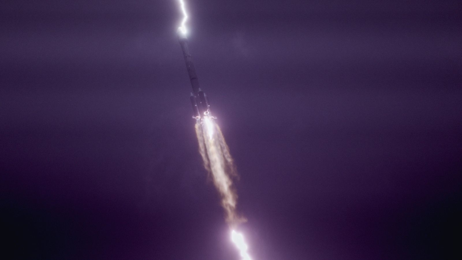 lightning strikes a rocket in the sky