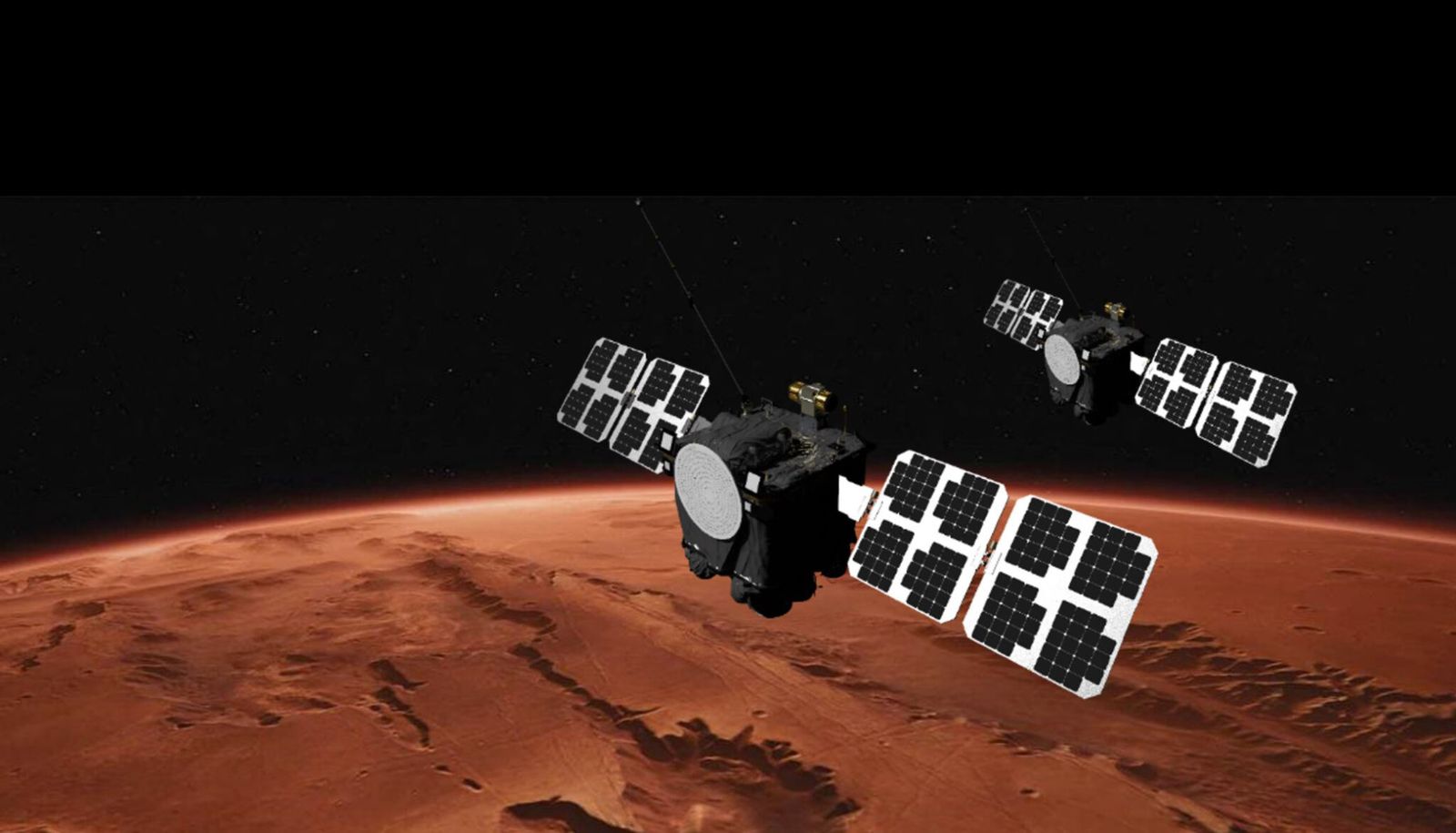 An illustration showing two large satellites with solar arrays on either side floating above the reddish-brownish surface of Mars.
