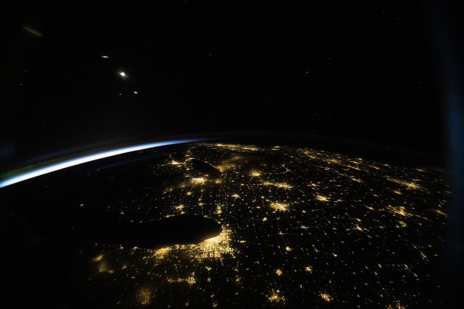 Chicago, Illinois (bottom center), appears prominently in this nighttime view of the United States—dotted with city lights including Detroit, Michigan; Cincinnati, Ohio; and New York City--taken at approximately 3:38 a.m. local time from the International Space Station as it orbited 259 miles above Earth.