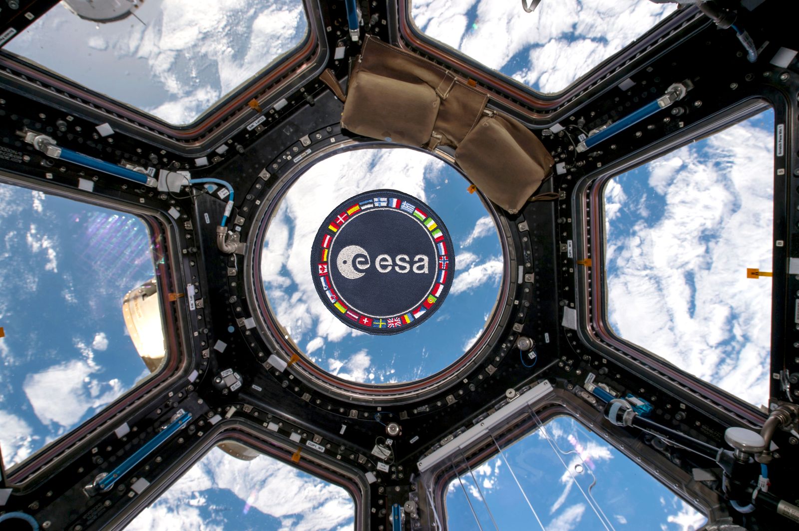 ESA patch floating in the ISS Cupola