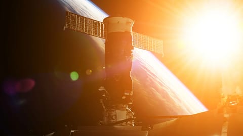 Two satellites orbiting in space.