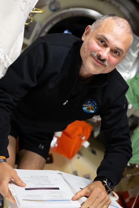 NASA astronaut Anil Menon reviews procedures for emergency scenarios while aboard the International Space Station as part of his long-duration science and research mission.