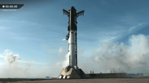 Tall rocket blue sky