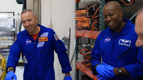 Artemis III astronauts Randy Bresnik and Andre Douglas visit the Multi-Payload Processing Facility at NASA's Kennedy Space Center on July 10, 2026.