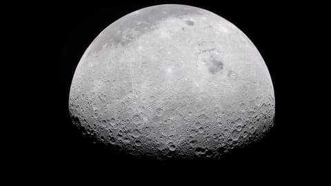 a grey, crater-marked orb on a black background