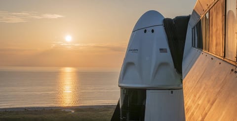 Crew Dragon at sunrise with Axiom logo