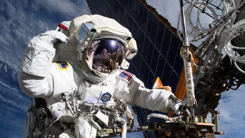 NASA astronaut and Expedition 72 Flight Engineer Anne McClain is pictured near one of the International Space Station’s main solar arrays during a spacewalk on May 1, 2025 to upgrade the orbital outpost’s power generation system and relocate a communications antenna.