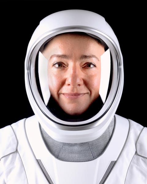 A person in a white spacesuit.