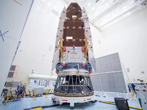 NASA's Nancy Grace Roman Space Telescope pictured on Friday, August 7, 2026, after engineers and technicians working inside the Payload Hazardous Servicing Facility at NASA’s Kennedy Space Center in Florida had carefully mated the observatory to its payload adapter and a strut payload attach fitting, a specialized piece of hardware designed for large, heavy loads. This allows the team to secure the payload to the second stage on SpaceX’s Falcon Heavy rocket. Image: Kennedy Space Center / NASA.
