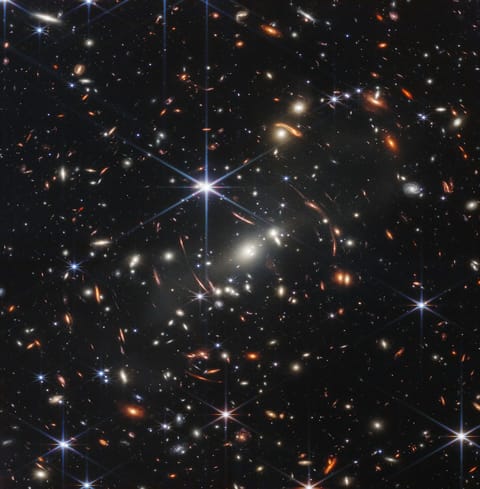 An image containing thousands of galaxies and stars on a black background, taken by the James Webb Space Telescope.