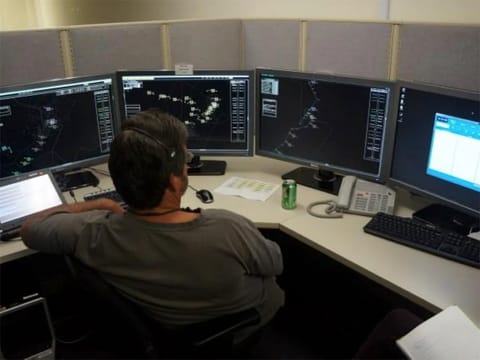 Air traffic controller taking part in a New York Operational Improvement research simulation in the Airspace Operations Laboratory (AOL) at NASA Ames Research Center.