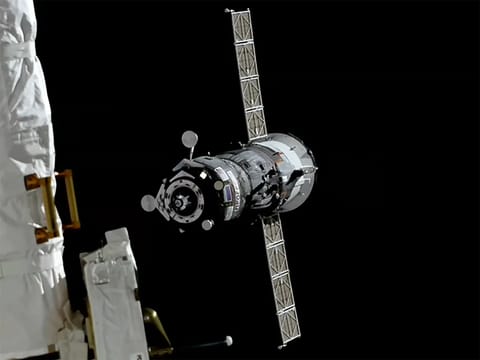 The Progress 96 cargo spacecraft approaches the International Space Station for a docking to the Poisk module.