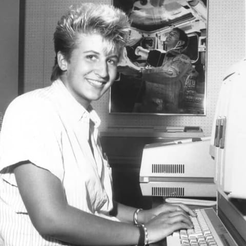 Julie Kramer White types on a computer keyboard during her internship with NASA