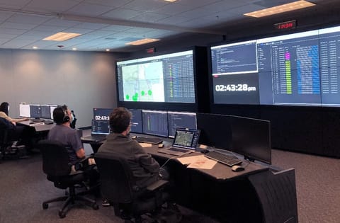 NASA researchers participating in a High Density Vertiplex (HDV) study in the Airspace Operations Laboratory (AOL).
