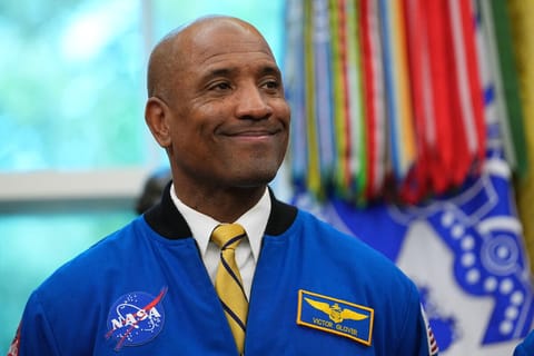 A man with a half-smile.