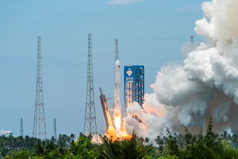 A Long March-10B carrier rocket blasts off from Wenchang Spacecraft Launch Site on July 10 in Wenchang, Hainan province, China. China achieved a controlled recovery of the rocket's booster, becoming only the second country to do so after the United States.