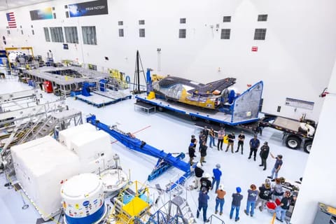 Dream Chaser Tenacity, Sierra Space's uncrewed cargo spacecraft, is lifted and moved by crane inside the Space Systems Processing Facility at NASA's Kennedy Space Center in Florida on Monday, May 20, 2024. (Courtesy/Shay Saldana/Sierra Space)