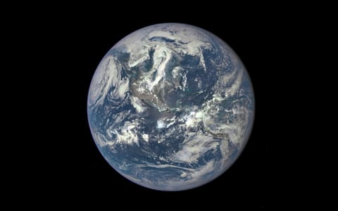 long-distance view of earth in deep space