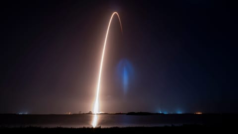 view of rocket launch streak and the rentry landing of the booster