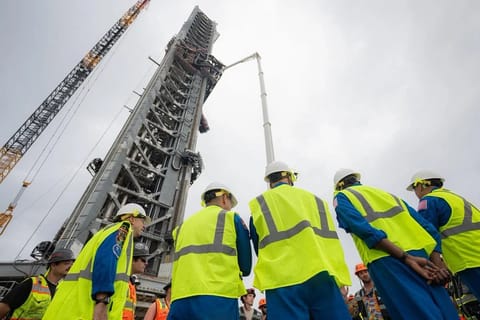 Artemis III crew members at the SpaceX Starship launch tower, LC-39A, Kennedy Space Center