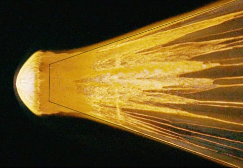 A stony meteorite in NASA Ames Research Center's Arcjet Interaction Heating Facility.