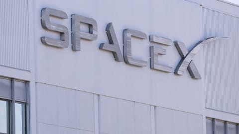SpaceX signage is displayed outside a Space Exploration Technologies Corp. facility in Hawthorne, California in March 2026