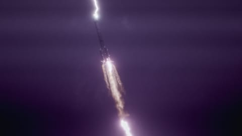 lightning strikes a rocket in the sky