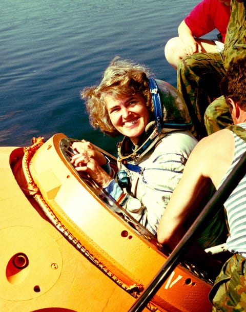 Shannon Lucid egressing from a training version of a spacecraft