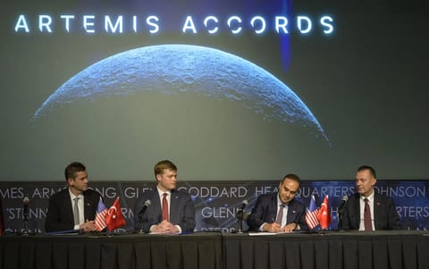 Turkish Minister of Industry and Technology, Mehmet Fatih Kacır, 3rd from left, signs the Artemis Accords for the Republic of Türkiye as NASA Administrator Jared Isaacman, left, U.S. Deputy Assistant Secretary of State for Space and Environment Connor Tomlinson, and Turkish Space Agency President, Yusuf Kıraç, right, look on, Monday, August 31, 2026, at the Mary W. Jackson NASA Headquarters building in Washington. Türkiye is the 71st country to sign the Artemis Accords, which establish a practic