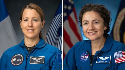 Astronauts Sophie Adenot of ESA and Jessica Meir of NASA pose for their official crew at the Johnson Space Center in Houston, Texas.