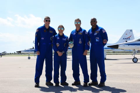 Image shows NASA's Artemis II astronauts dressed in their blue flight suit at the Launch and Landing Facility at NASA's Kennedy Space Center in Florida on Friday, March 27, 2026. Photo credit: NASA/Kim Shiflett