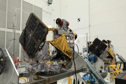 NASA’s ESCAPADE (Escape and Plasma Acceleration and Dynamics Explorers) identical dual spacecraft are inspected and processed on dollies in a high bay of the Astrotech Space Operations Facility near the agency’s Kennedy Space Center in Florida on Thursday, Aug. 22. As the first multi-spacecraft orbital science mission to Mars, ESCAPADE’s twin orbiters will take simultaneous observations from different locations around the planet and reveal the real-time response to space weather and how the Mart