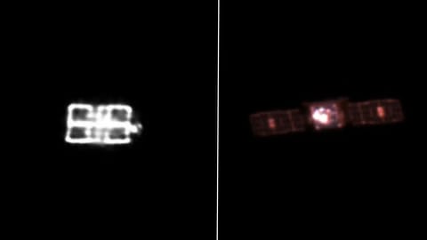 two cube-shaped spacecraft on a black background